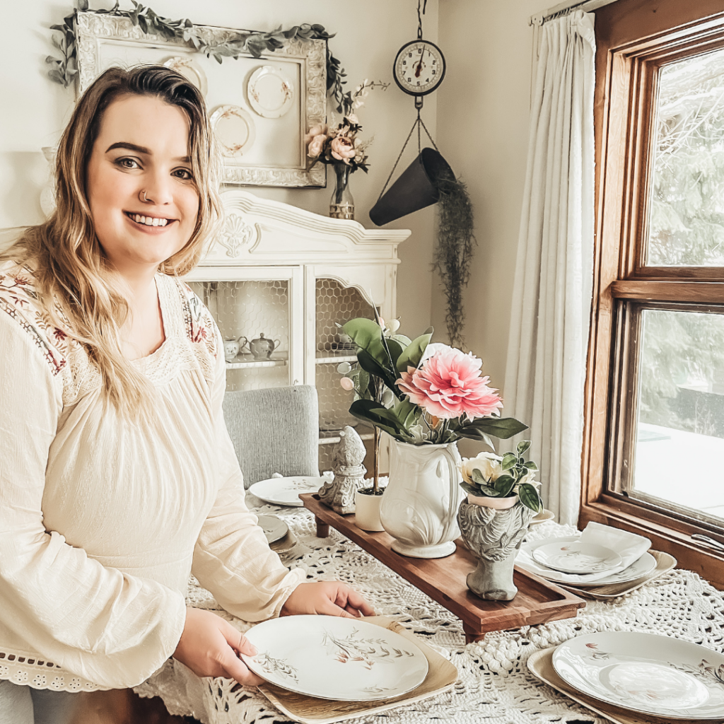 Rae setting a table at her home
