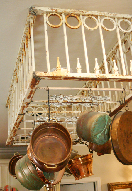 Rusty old fence made into a pot and pan holder that can hang from the ceiling in your kitchen
