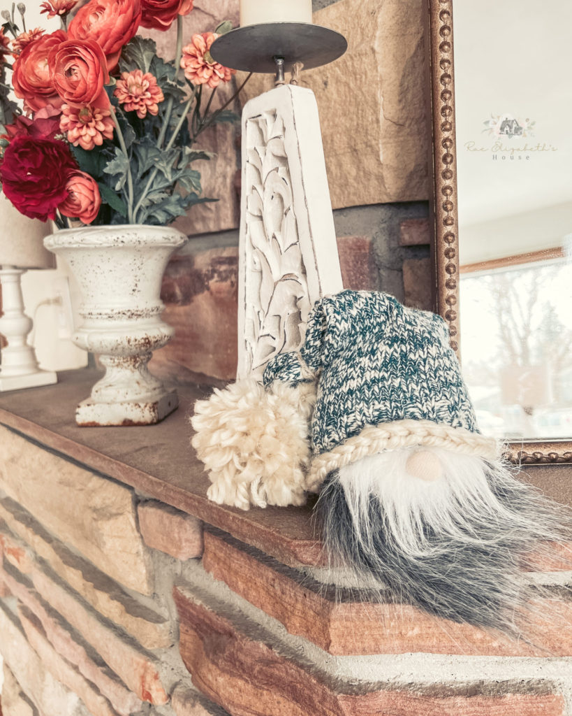 A single DIY gnome sitting on a mantle as a great house warming party idea