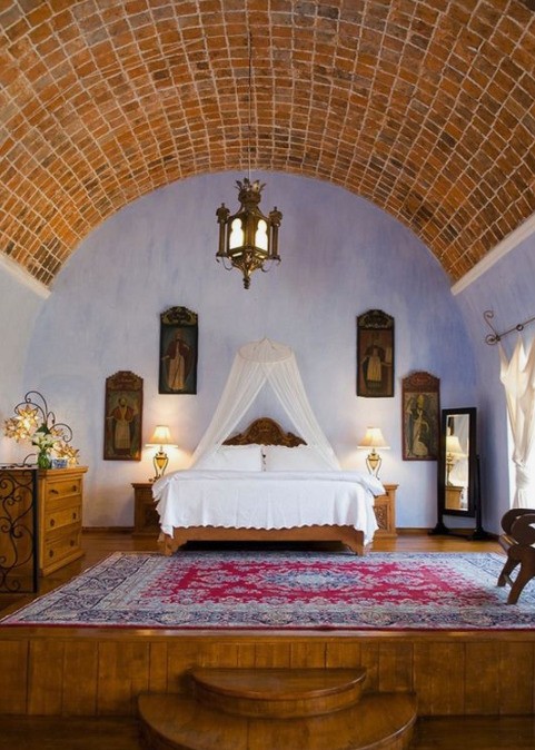 a beautiful Mexican-style bedroom with iron accents