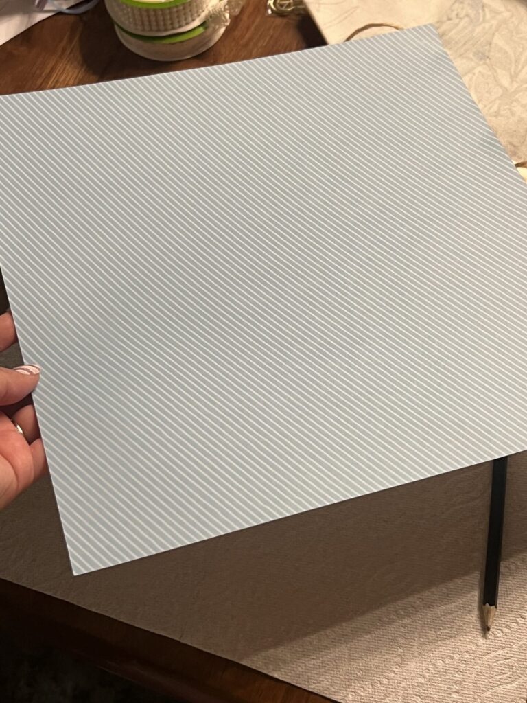a piece of patterned scrapbooking paper