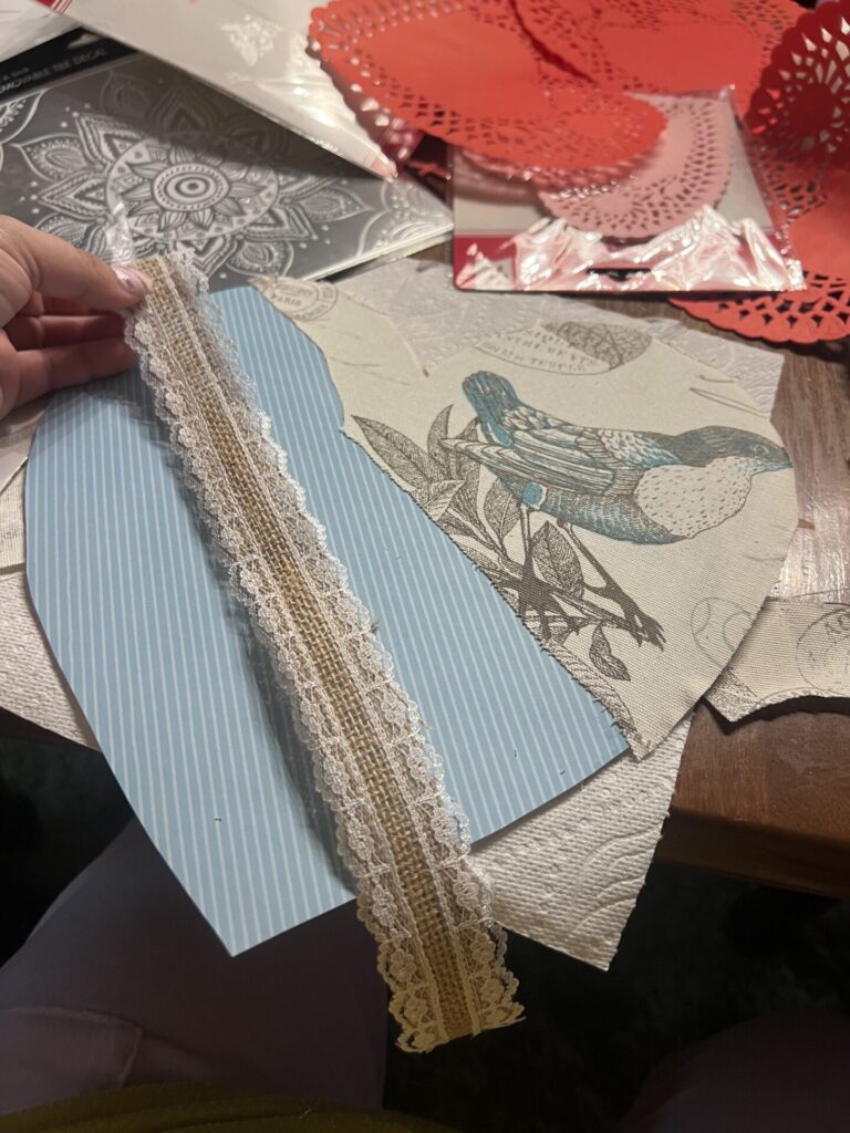 heart shaped door decoration and a piece of ribbon
