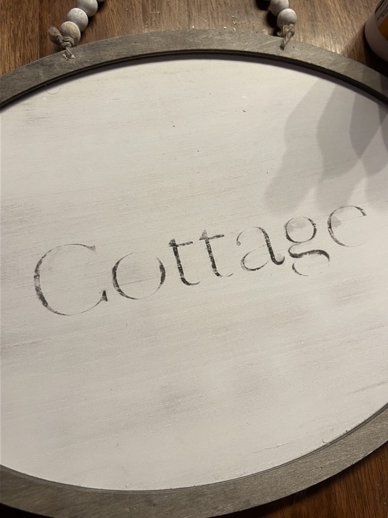 a third view of the wording on the wooden sign