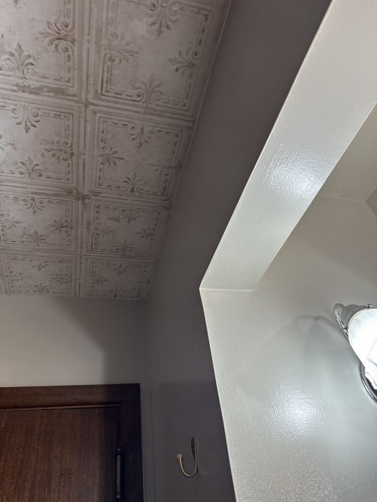old tile wallpaper on the ceiling