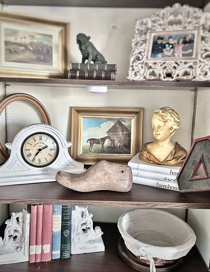 A collection of different antiques on a shelf