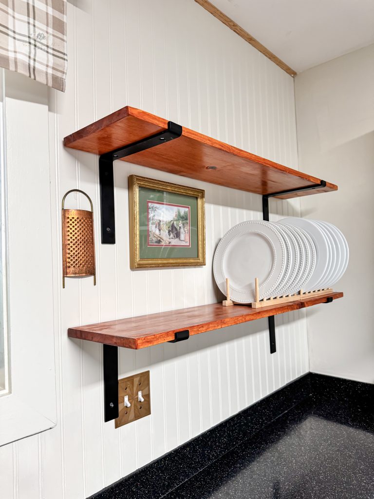 Plates and decor on modern farmhouse kitchen shelves